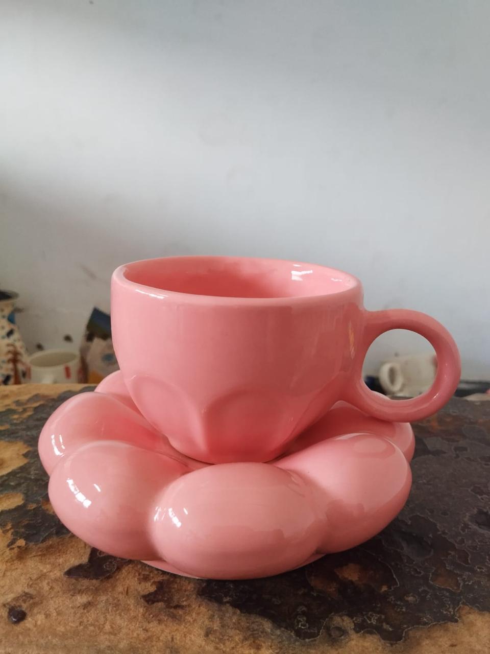 Pink ceramic cup with a sculpted flower saucer